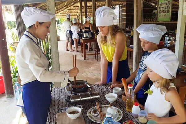 Students cook with local family - Vietnam school trips