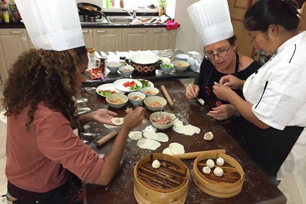 Students make dumpling in Shanghai - China school trips